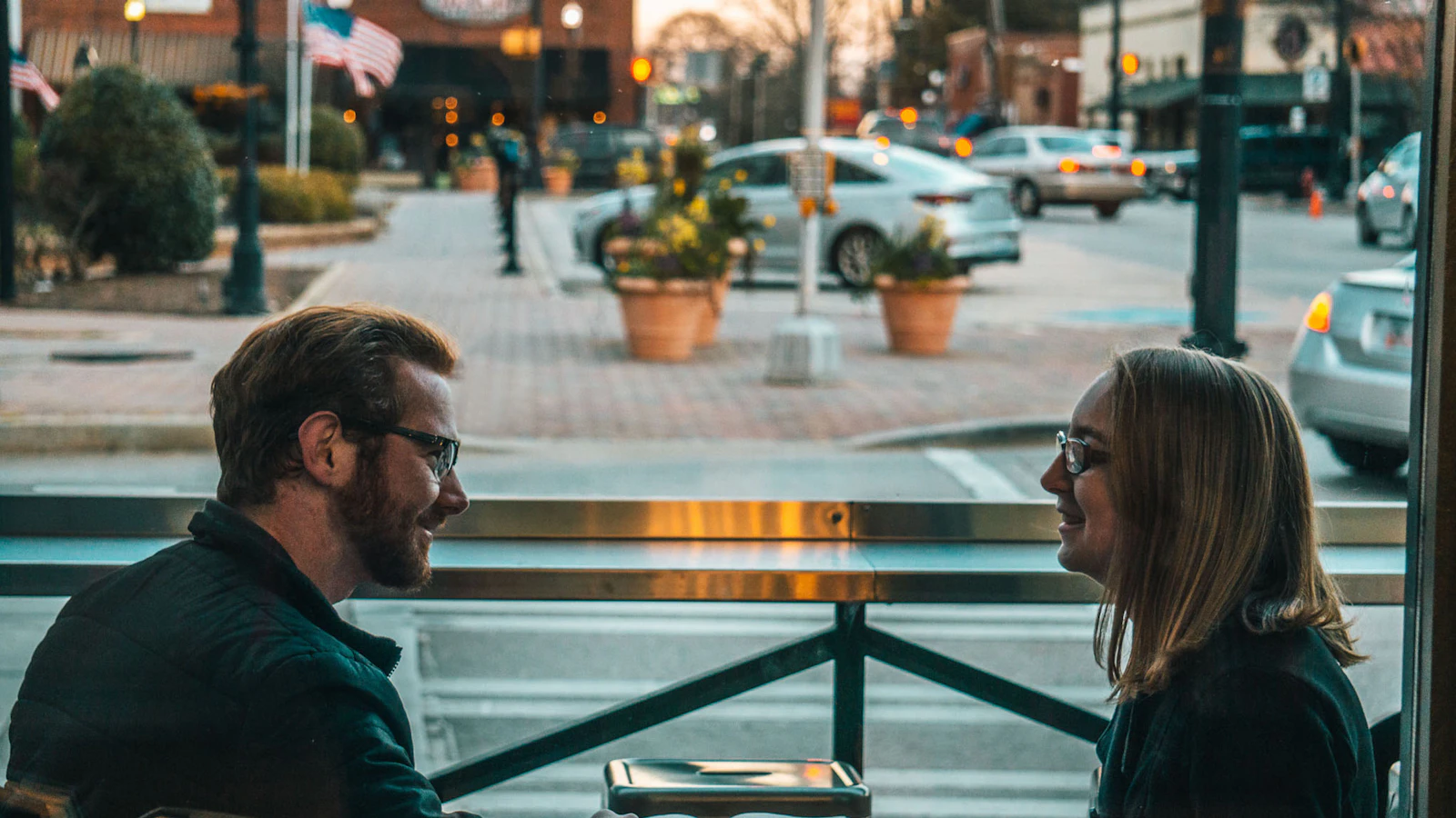 A couple sitting and talking calmly during the day.